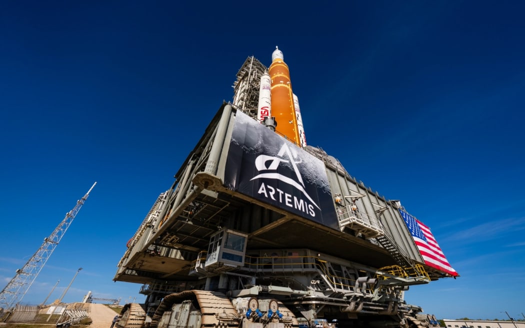 NASA's crawler-transporter carries the powerful SLS rocket and Orion spacecraft to a launchpad in preparation for the Artemis II mission around the Moon and back. Shown at the Kenney Space Centre, Florida, on 17 January, 2026.