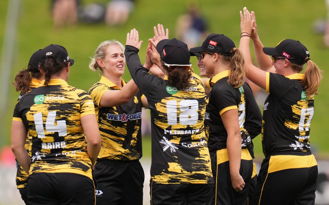 The Blaze players celebrate a wicket in the Super Smash.