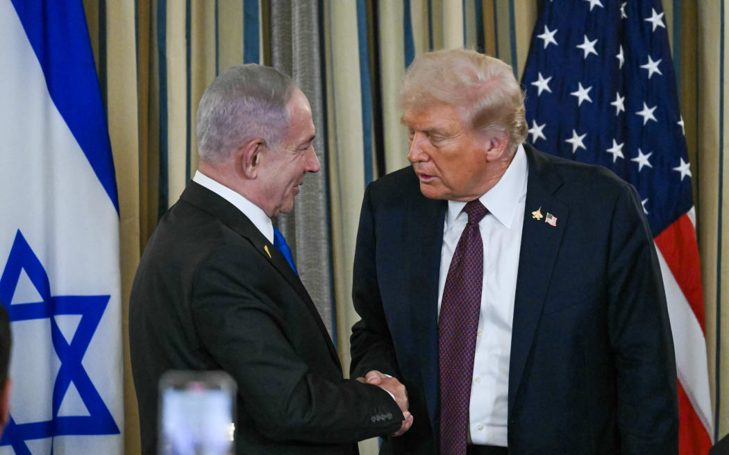 US President Donald Trump and Israeli Prime Minister Benjamin Netanyahu (L) shake hands at the end of a press conference in the State Dining Room of the White House in Washington, DC on September 29, 2025. US President Donald Trump said on Monday that Washington was