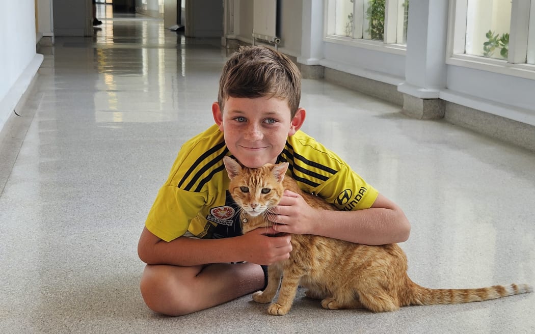 Theo Cowley gets a cuddle from Mr Pip