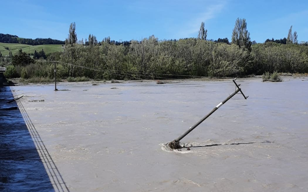 Damaged power pole in the Waiau River bed, near the Waiau township.