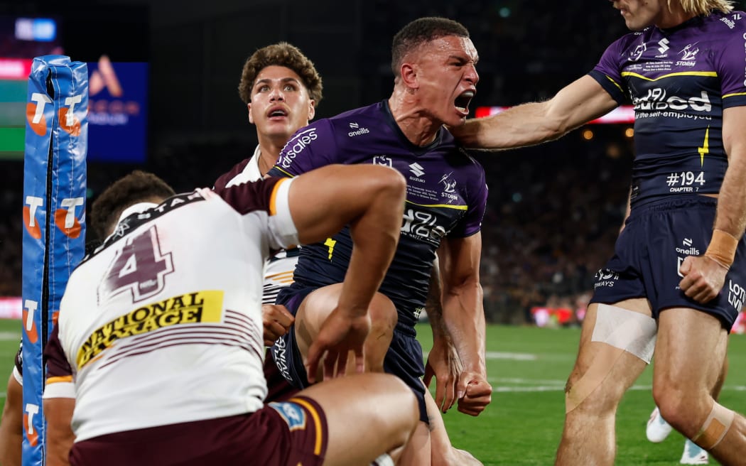 Will Warbrick of the Storm celebrates scoring a try with team mates during the NRL Grand Final match between the Brisbane Broncos and the Melbourne Storm at Accor Stadium.