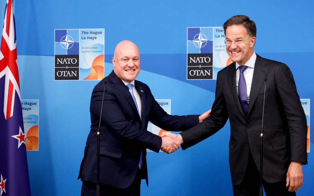 NATO Secretary General Mark Rutte (R) welcomes New Zealand's Prime Minister Christopher Luxon (L) as they address the press before their meeting at the NATO summit in The Hague on June 24, 2025. (Photo by Geert Vanden Wijngaert / POOL / AFP)