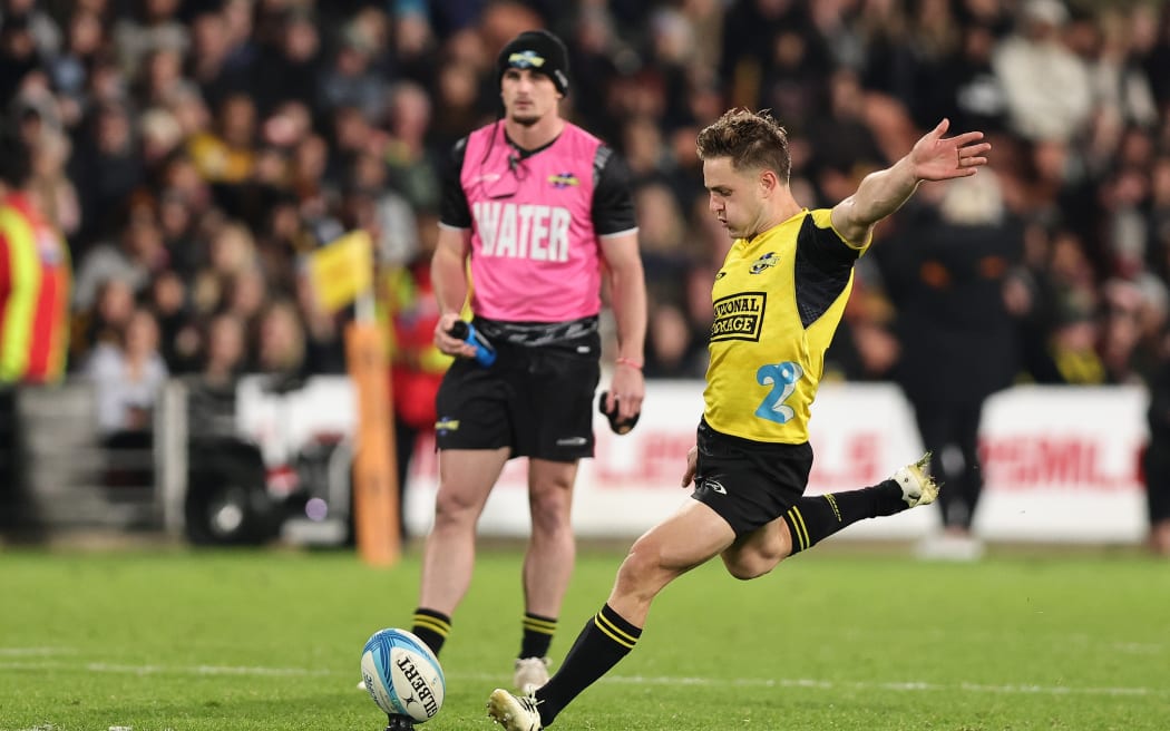 Brett Cameron of the Hurricanes kicks the winning penalty against the Chiefs.