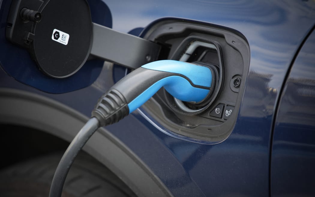 Detail of a Ford car is seen being charged via a cable from a charger in Warsaw, Poland on 14 June, 2022. (Photo by STR/NurPhoto) (Photo by NurPhoto / NurPhoto via AFP)