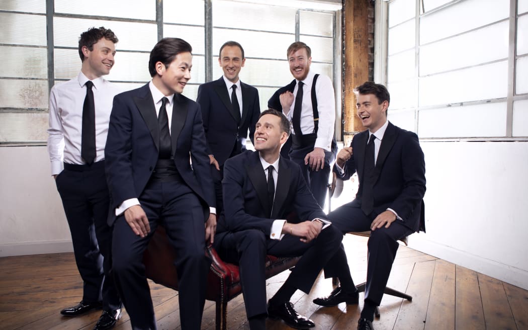 The Kings Singers post in suits.