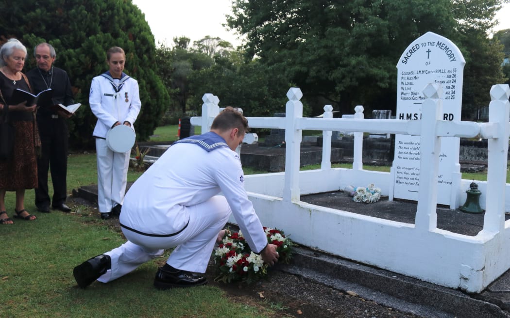Navy sailor Brandyn Sigley lays a wreath at the HMS Hazard memorial during the 175th anniversary commemorations of the Battle of Kororāreka in 2020.
