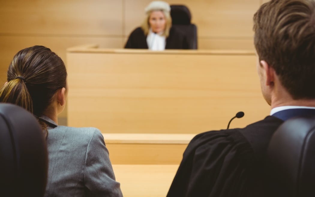 Judge talking with lawyers to make a decision in the court room