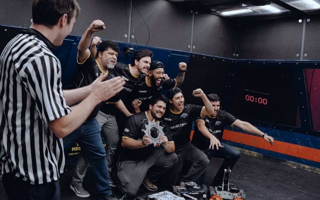 Picture of a group posing for a victory photo.