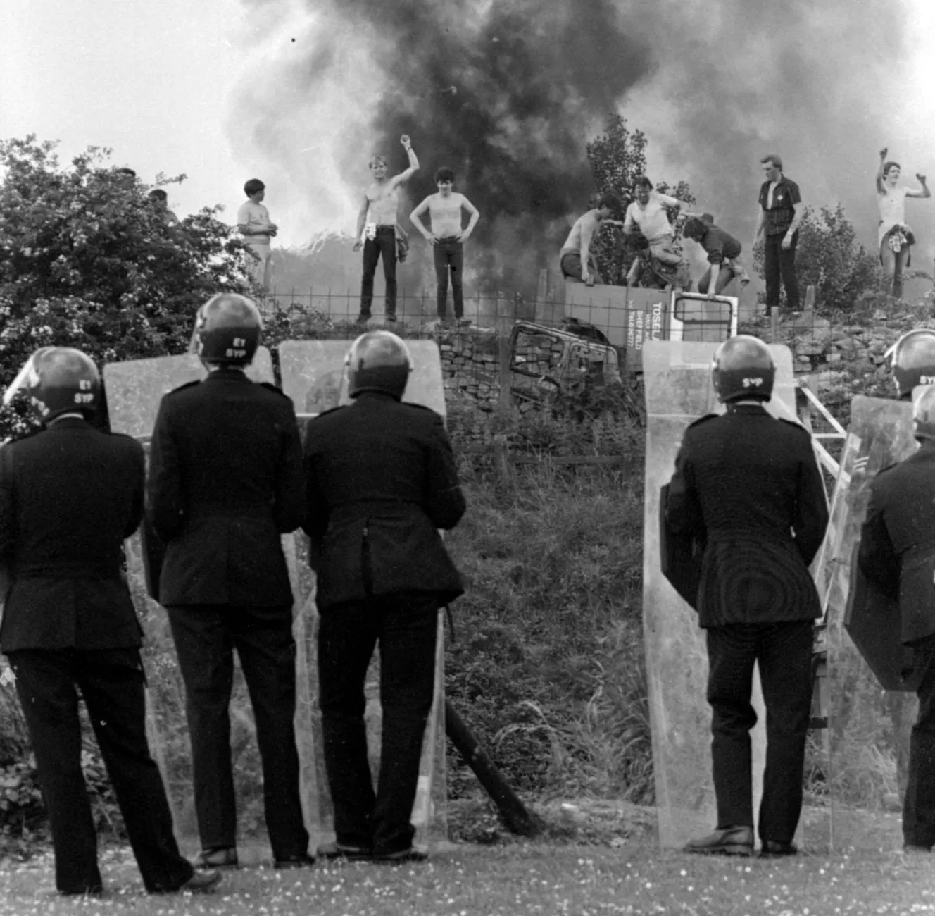 Riot police facing striking miners during the Battle of Orgreave.