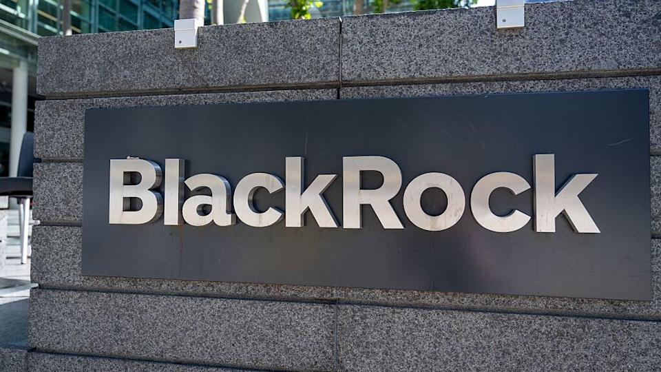 Exterior sign for BlackRock investment firm outside office building, San Francisco, California.
