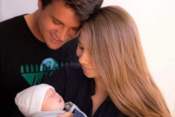 Bindi Irwin and her husband Chandler Powell with first child, Grace Warrior Irwin Powell, in 2021.