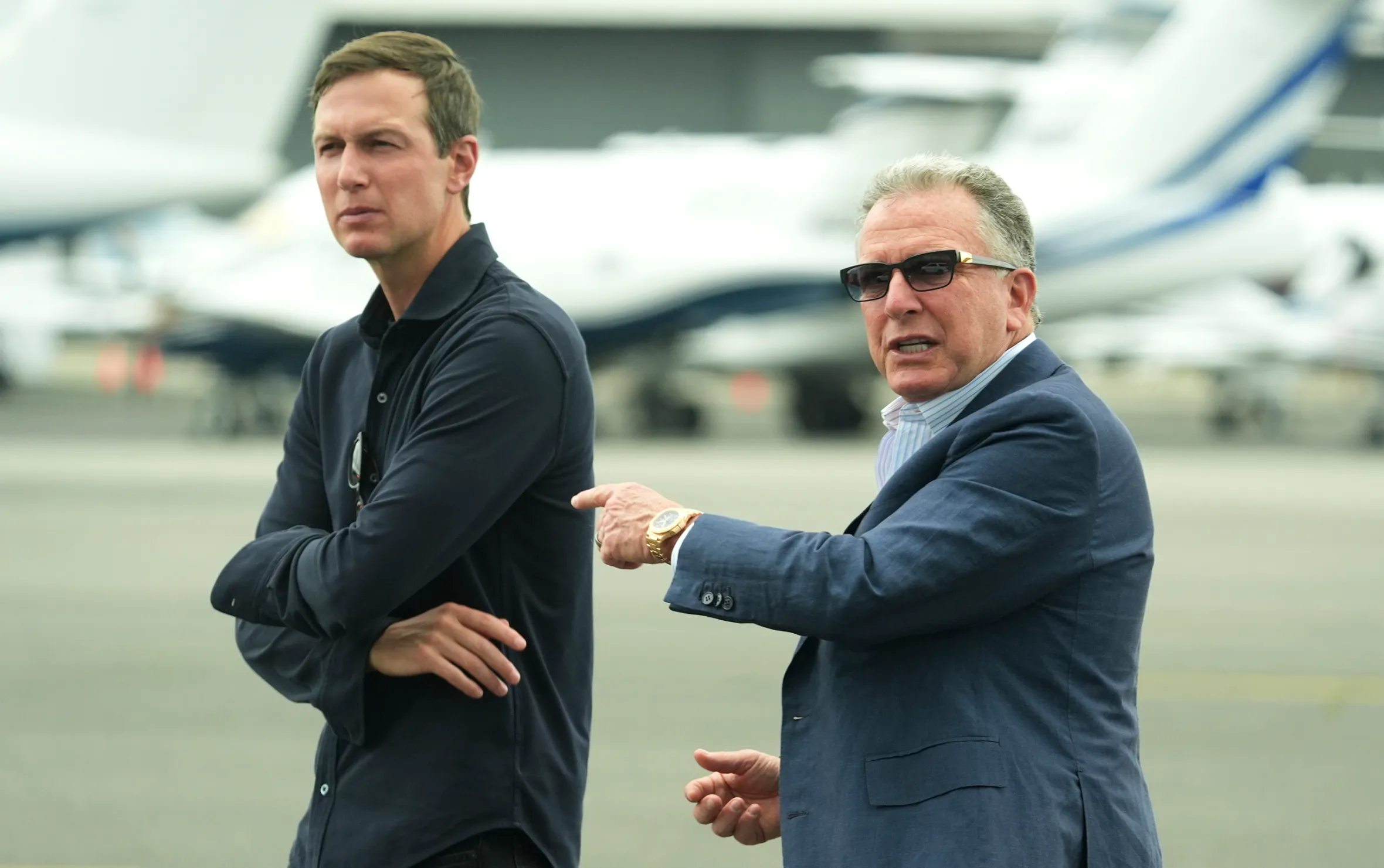 White House special envoy Steve Witkoff and Jared Kushner wait for the arrival of President Donald Trump.