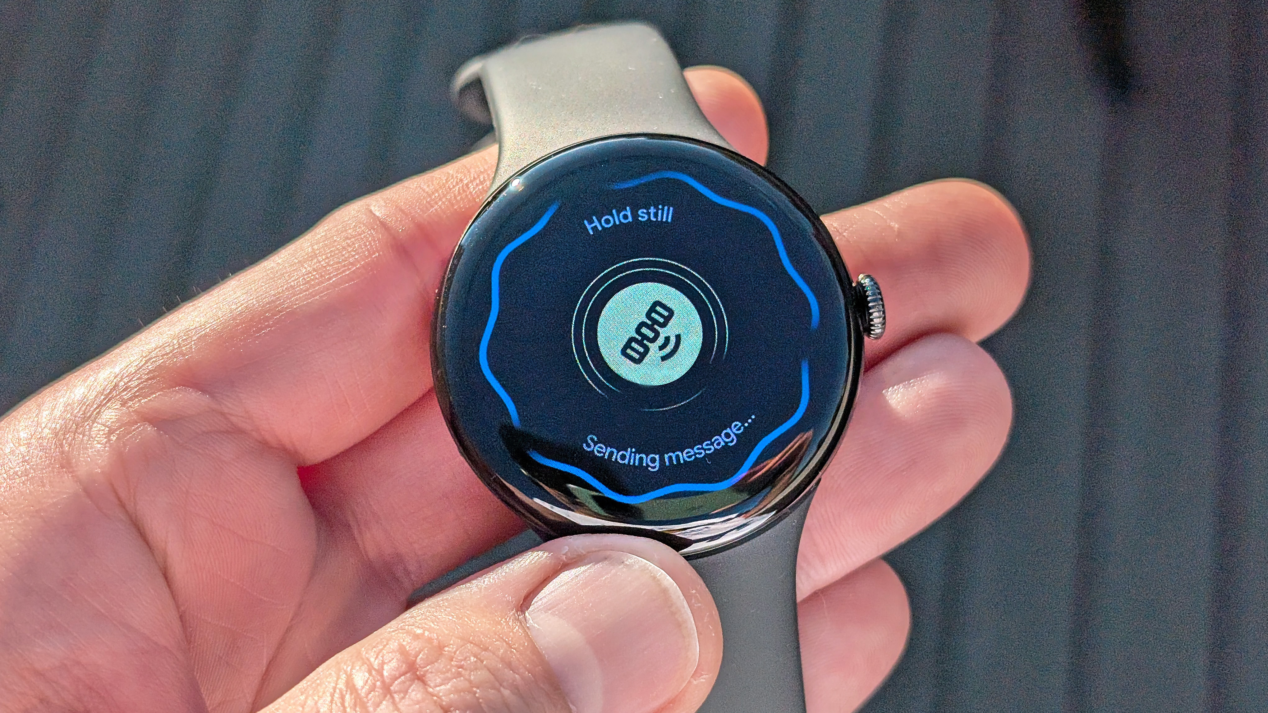 Close-up of the Google Pixel Watch 4 in black on a black strap