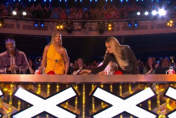Amanda Holden hits the golden buzzer on Britain's Got Talent Amanda Holden hits the golden buzzer on Britain's Got Talent