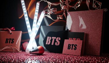 An extreme close-up photograph of shimmering, glittering BTS merchandise and fan goods, such as light sticks and album covers, captured with dramatic studio lighting to create a high-fashion, glamorous aesthetic.