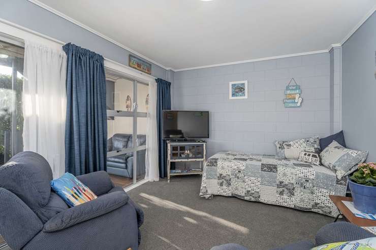 A one-bedroom downstairs unit in the Paradise Coast complex on Barbara Avenue is expected to sell for less than RV. Photo / Supplied