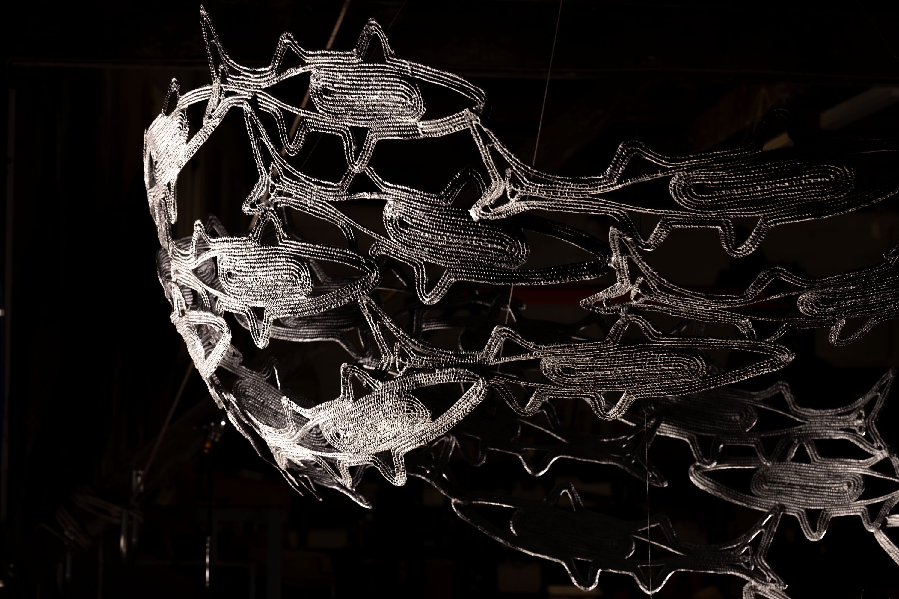 Watawan (mullet) by Shellie Smith and Julie Squires; an installation of a spiral of silver aluminium-casted fish.