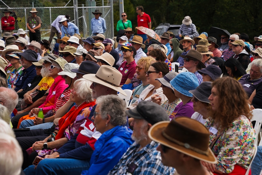 Crowd of people sitting down