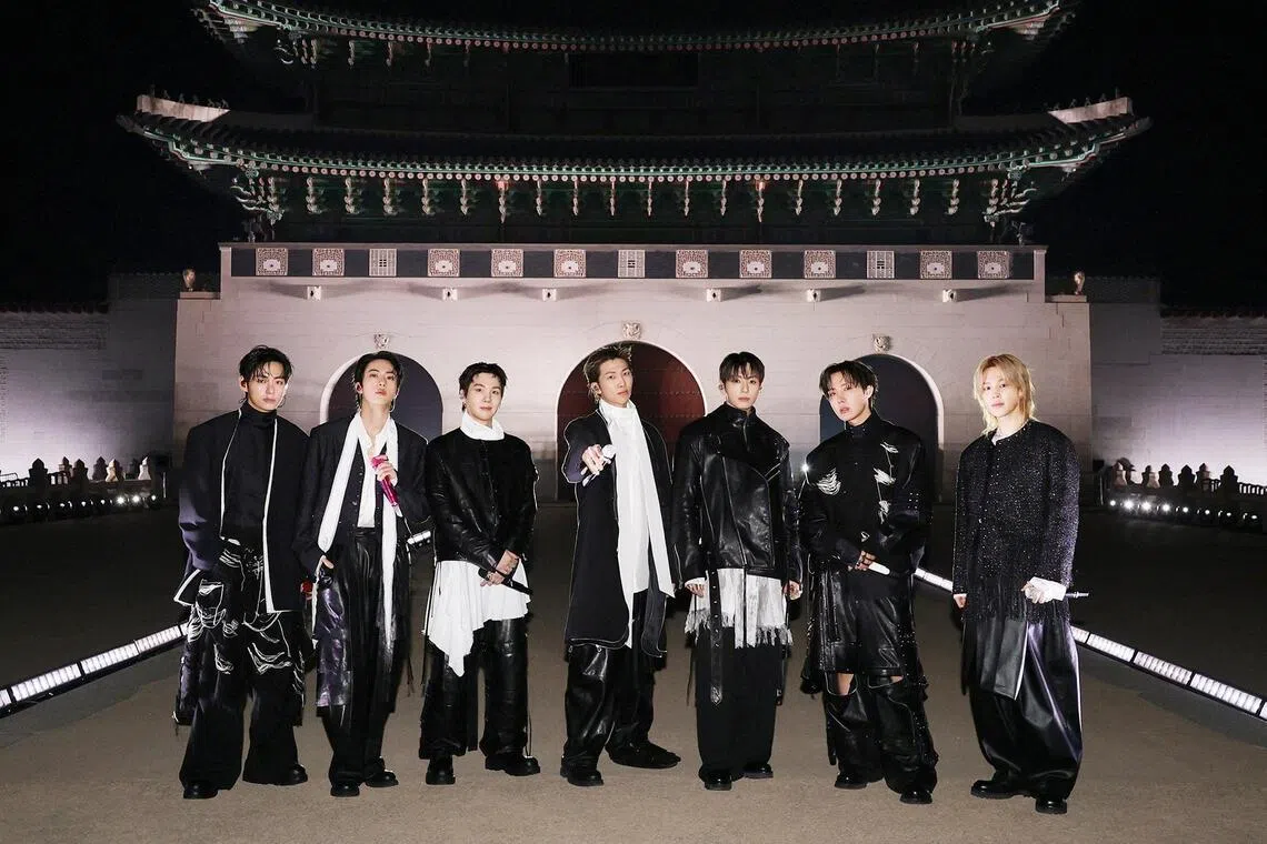Kpop group BTS posing for photographs upon their arrival for ‘BTS The Comeback Live Arirang’ concert in central Seoul on March 21, 2026.