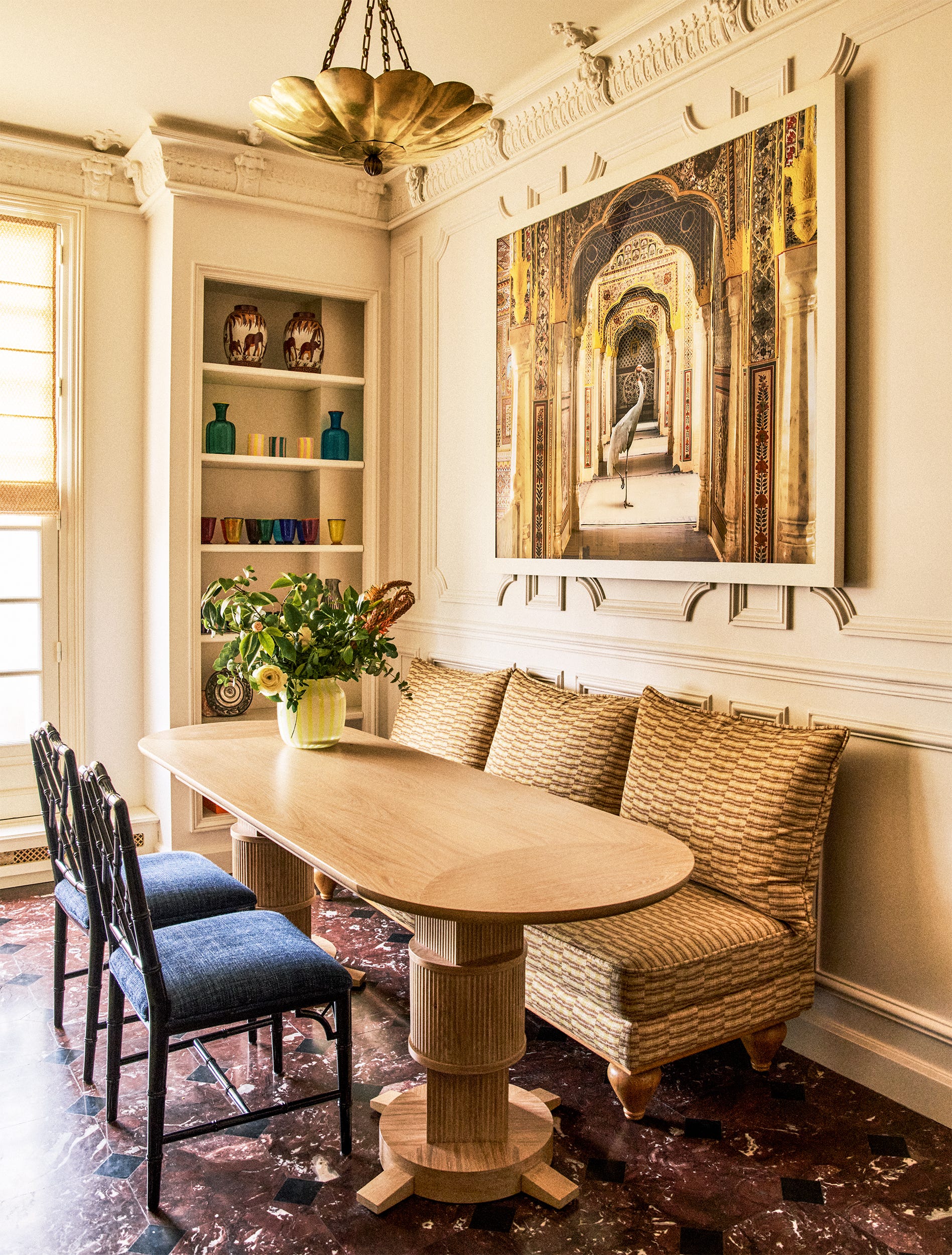 Dining area featuring a wooden table and decorative elements.