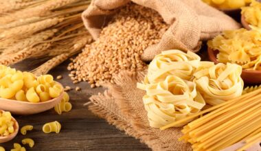 dried pasta and wheat on the wooden board