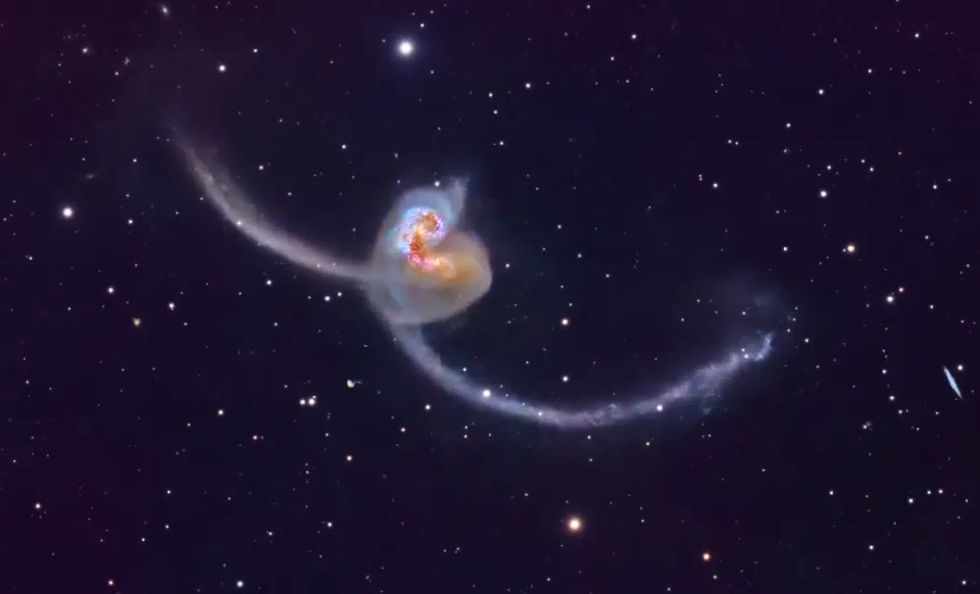 Astronomers Capture Two Galaxies On A Collision Course In A Stunning Deep Space Image