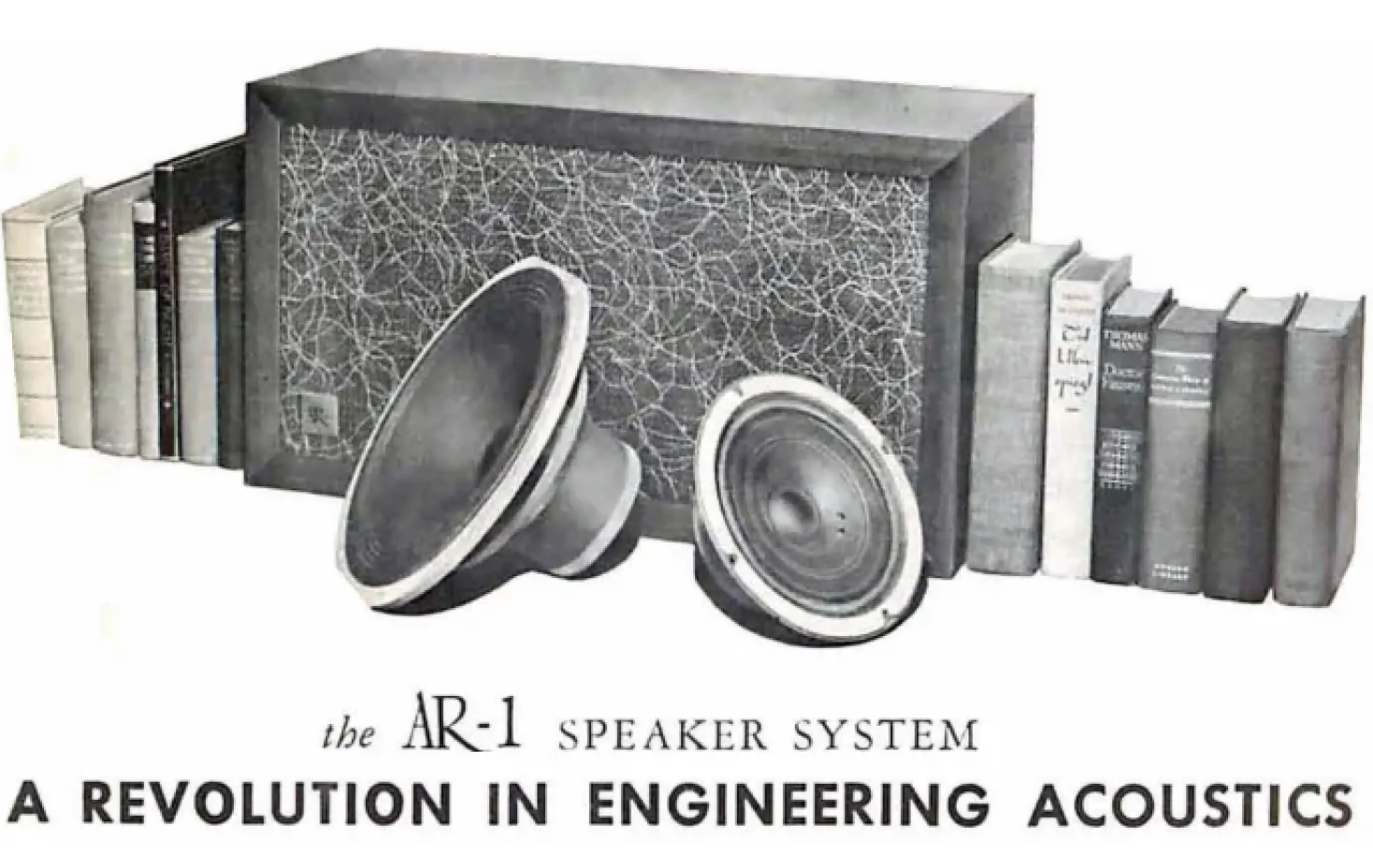 Acoustic Energy AR-1 speaker system advert showing the speakers next to some books
