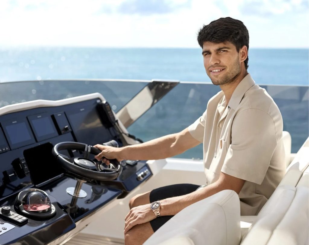Carlos Alcaraz sits at the helm of a Sunreef Yacht  // Photo credit: Sunreef