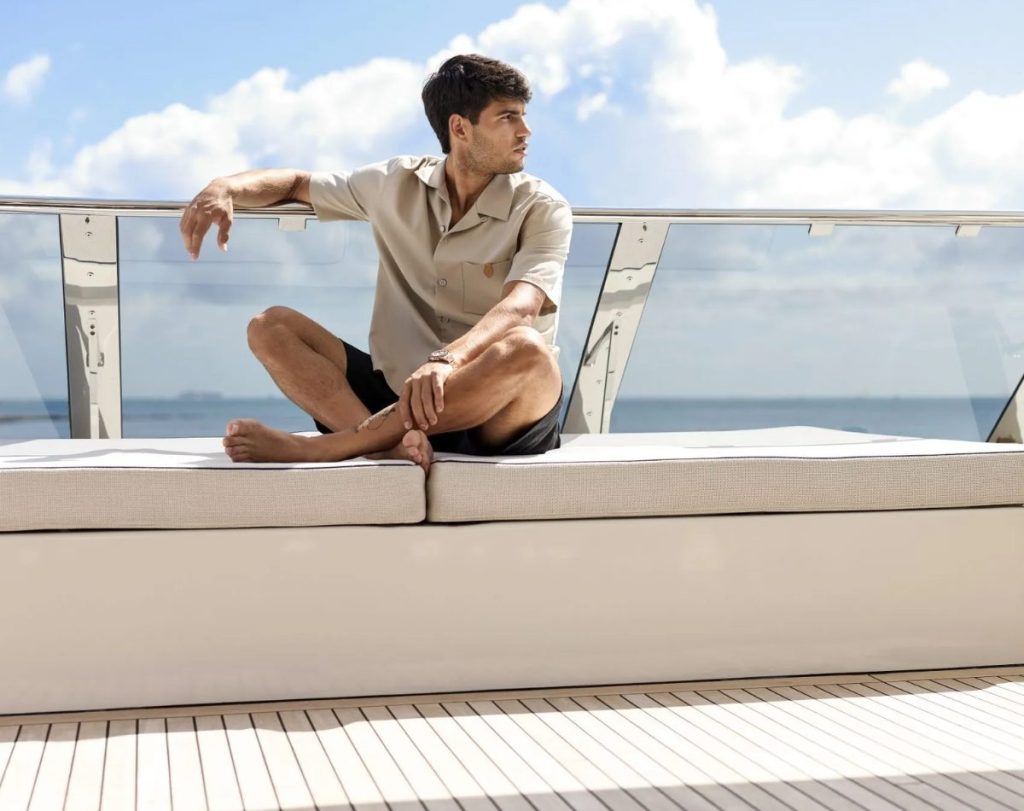 Carlos Alcaraz leaning on the railing of a 80 Sunreef Power yacht //  Photo credit: Sunreef