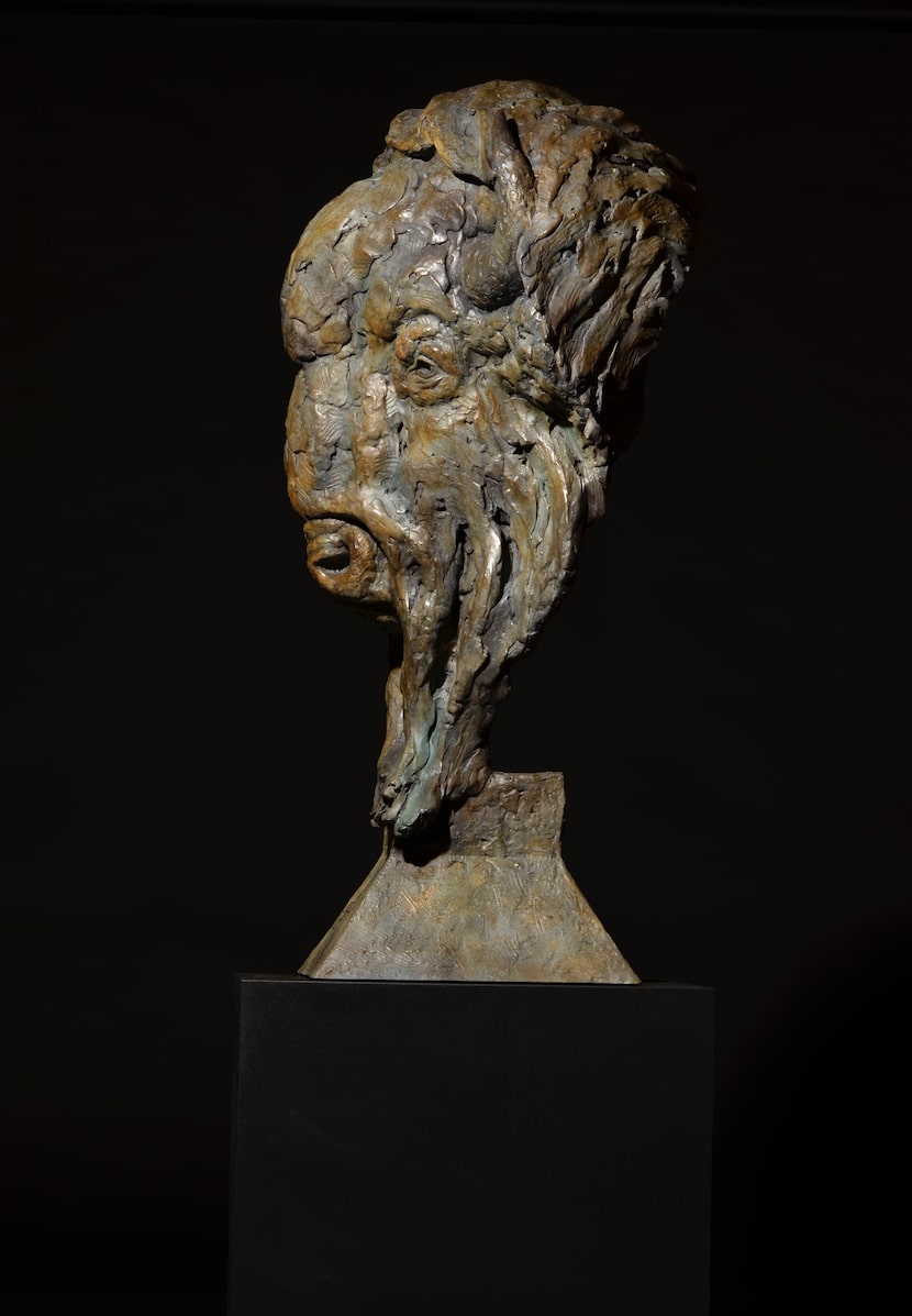 "American Icon," a 2020 bronze bust of an American bison by sculptor Mick Doellinger, is...