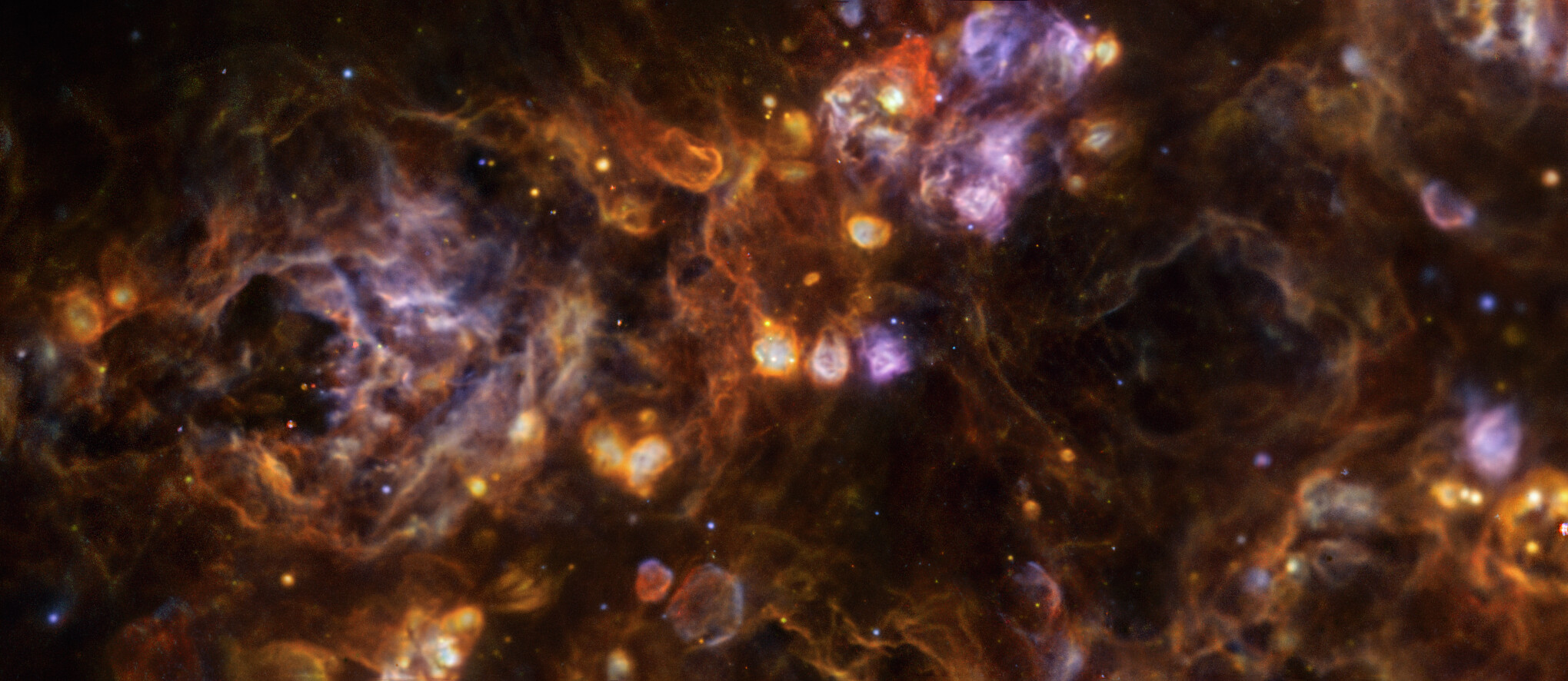 swirls and clouds of rainbow colors on a black background