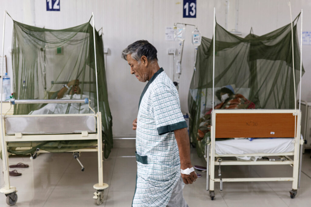 A dengue fever patient walks inside the Sergio Bernales National Hospital in the outskirts of Lima, Peru, on April 17, 2024. Credit: Juan Carlos Cisneros/AFP via Getty Images