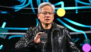 Jensen Huang holds up chip at CES 2025