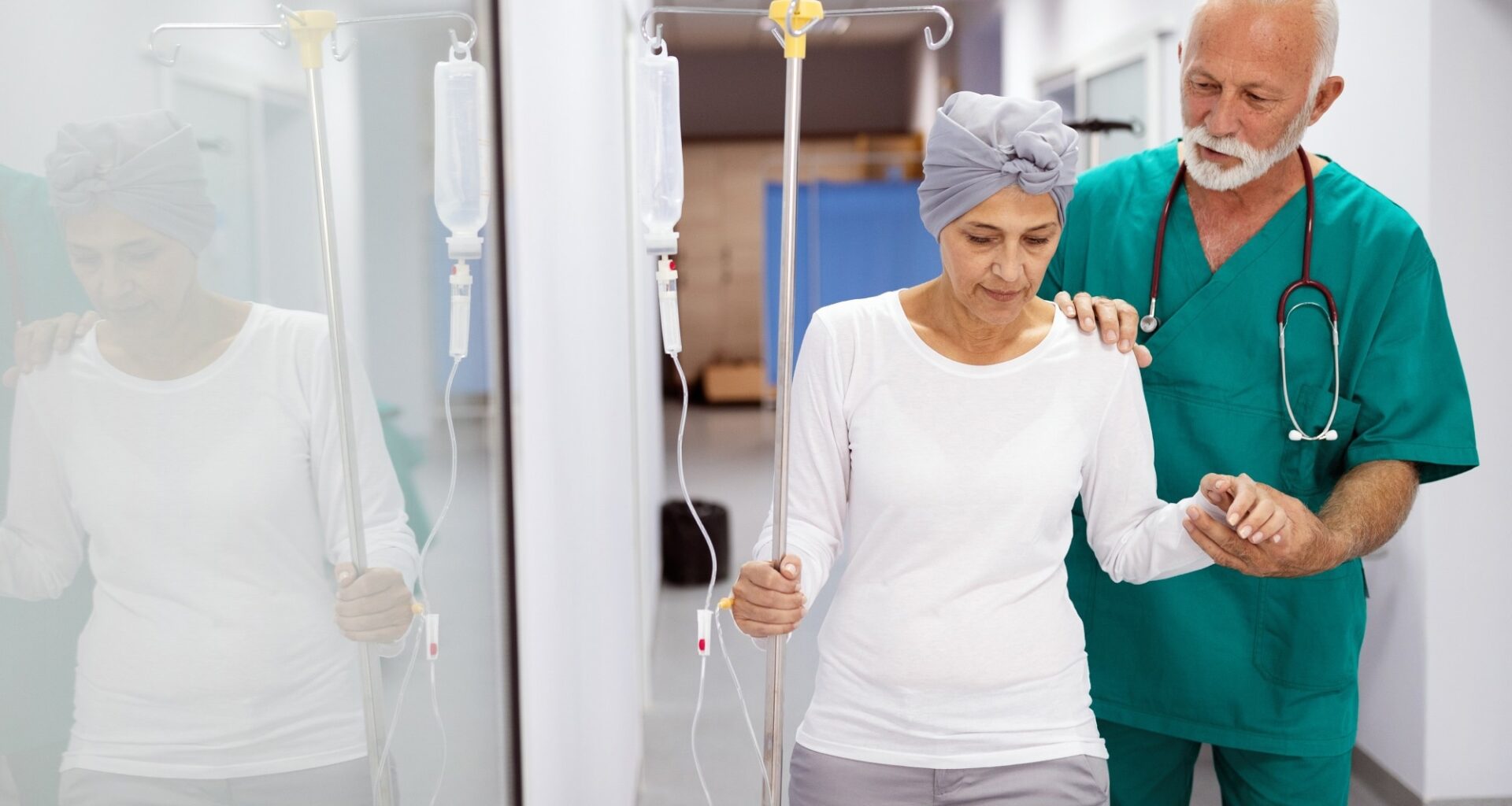 Woman with cancer during chemotherapy walking around the hospital, aided my doctor