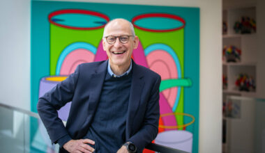 Headshot of Dr. Ezekiel Emanuel wearing a suit and smiling at the camera.