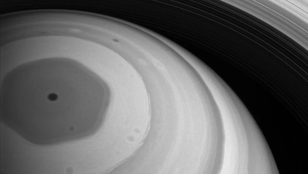 The whole northern region of Saturn is bathed in sunlight in this view from late 2016, taken by NASA's Cassini spacecraft, which was purposely crashed into Saturn to avoid potential contamination of its pristine moons. Image Credit: NASA 