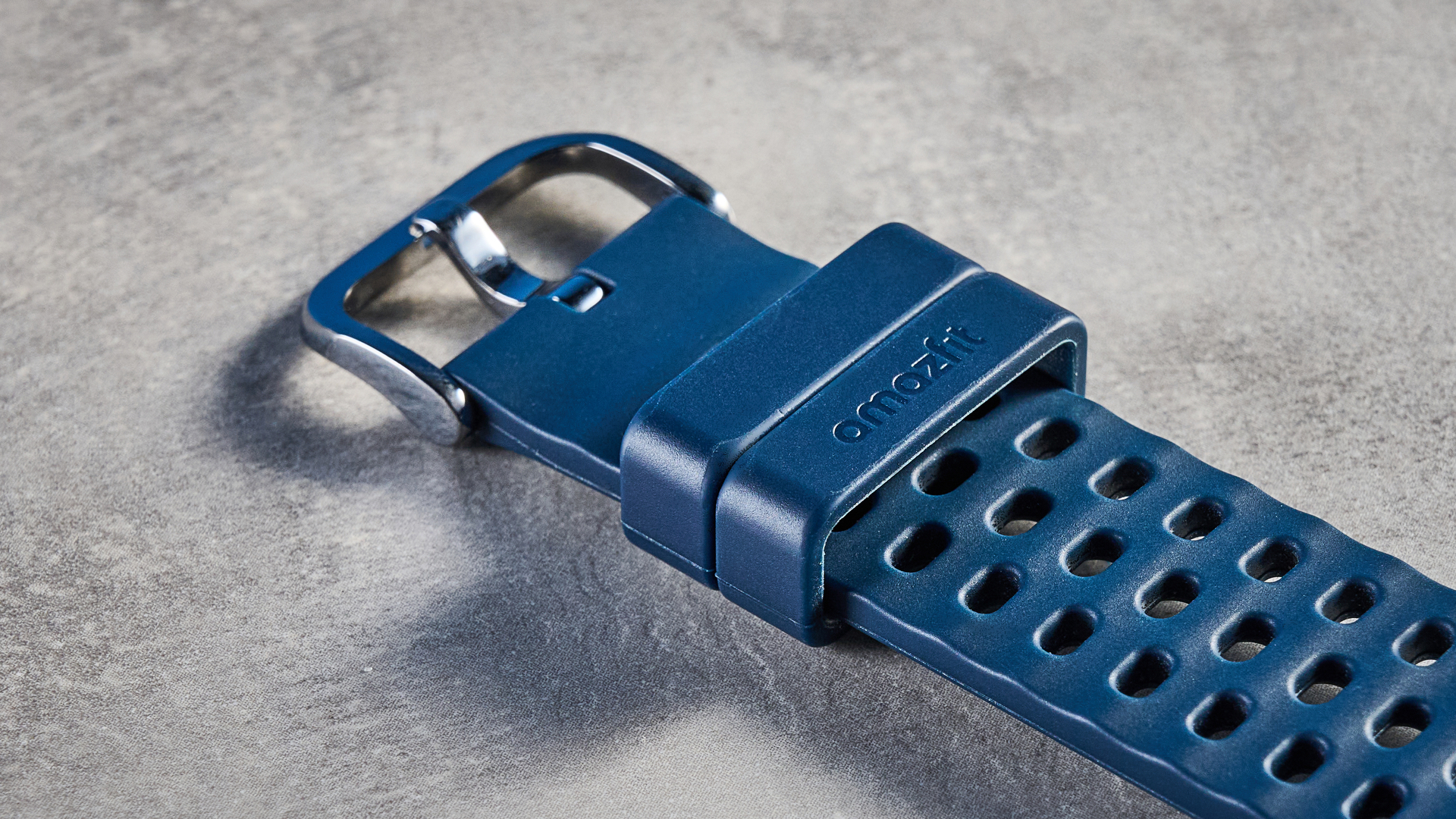 the amazfit active 3 premium photographed against the blue tom's guide background