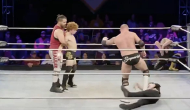 Wrestling ref kicked out of the way by performers while convulsing in the ring