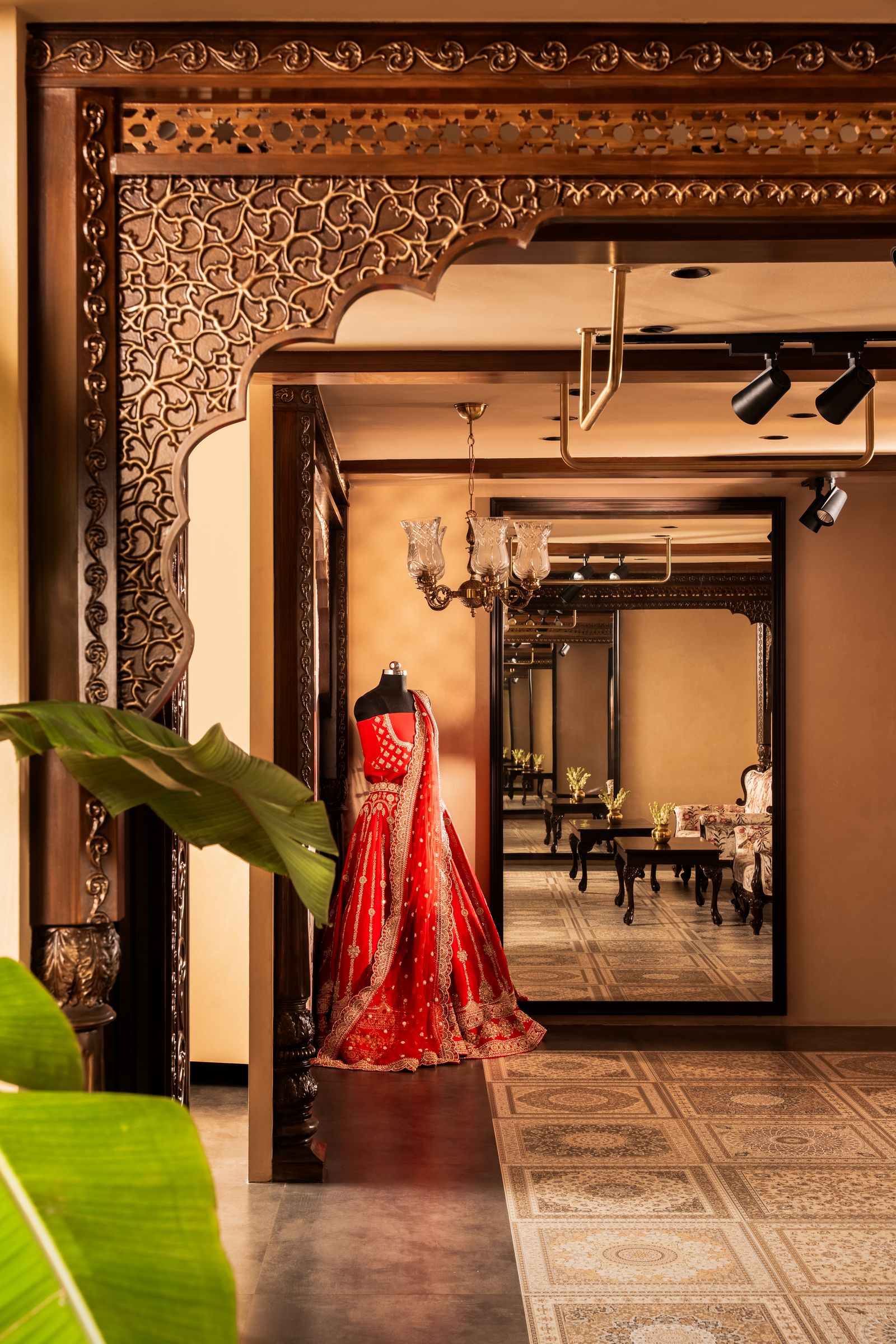 Image may contain Clothing Dress Formal Wear Fashion Gown Wedding Wedding Gown Indoors Interior Design and Floor