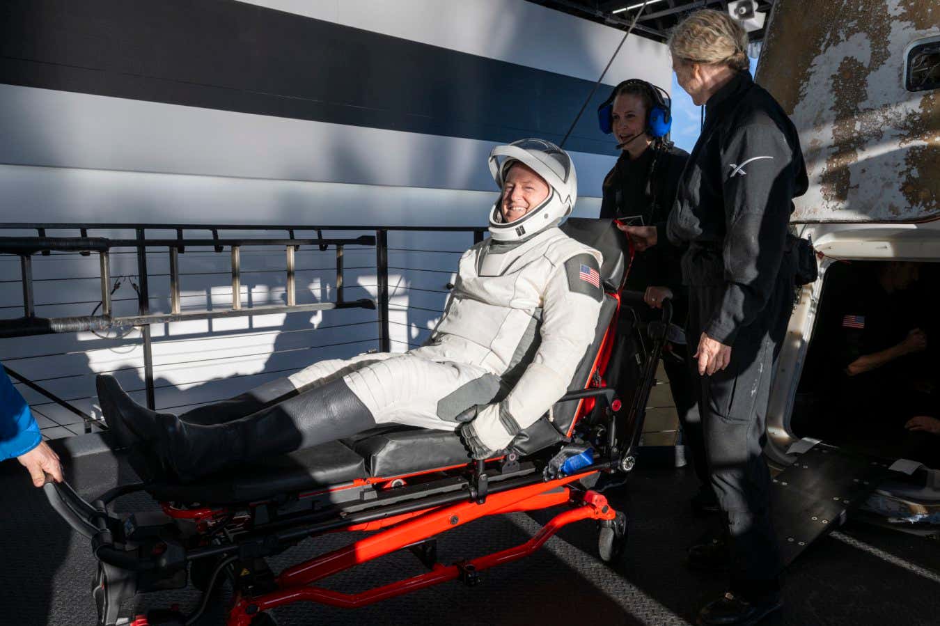 NASA astronaut Butch Wilmore is stretchered out of the return capsule after an unexpectedly long stint on the International Space Station
