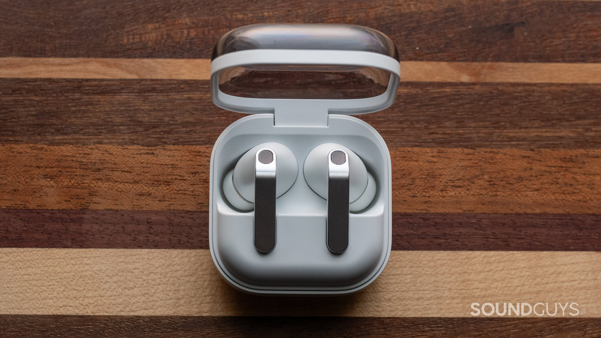 Samsung galaxy buds 4 pro on wooden table