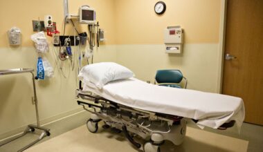 An exam bed sits in a room.