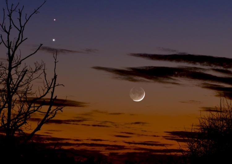 Venus and Mars in conjunction with Moon below Feb 20 2015 - Martin Campbell, Looking at the western evening sky on February 20th 2015, the photographer was aware that dazzling Venus and the red planet Mars had been locked in a celestial embrace over the previous few nights. When a young crescent Moon muscled in on the planetary dance it provided him with a compelling photographic opportunity.