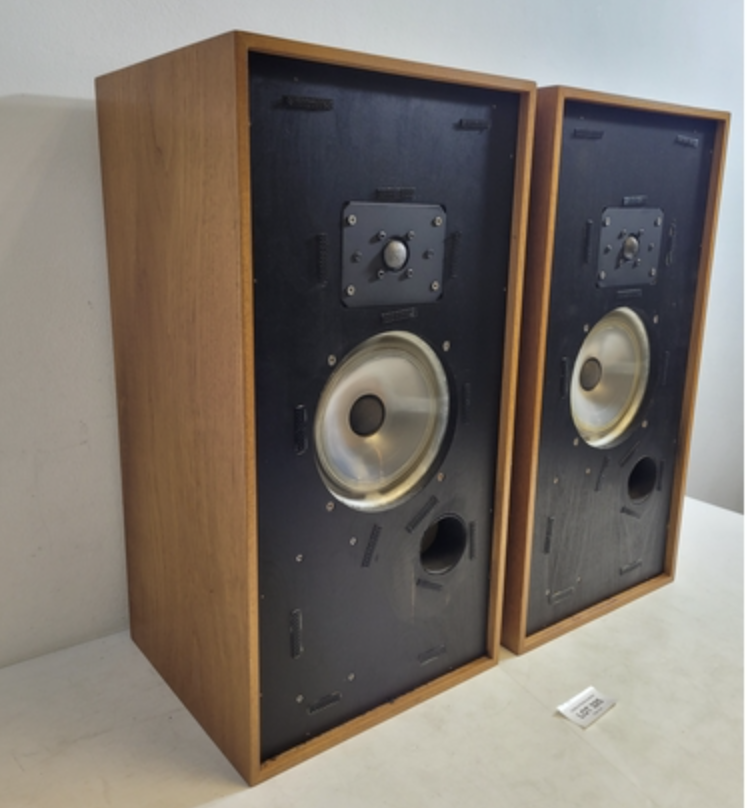Harbeth HL Monitor Mk1 speakers in brown wood on cream coloured background