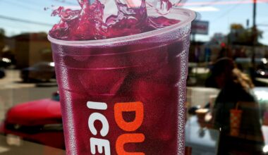 A Dunkin’ Ad on the front of store in West Roxbury on Oct. 10, 2025.