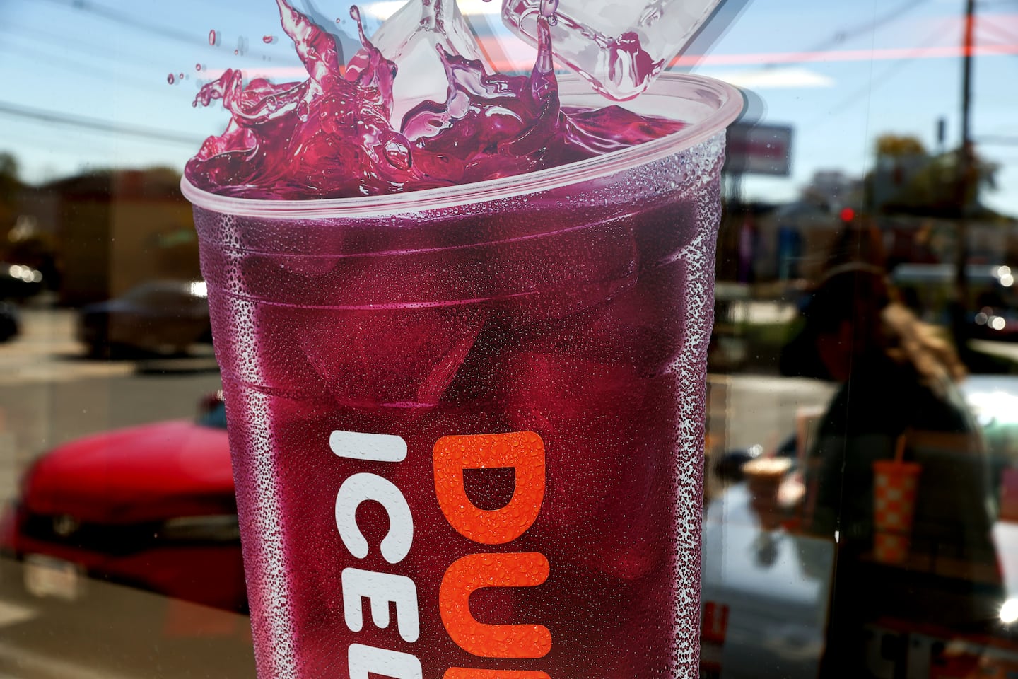 A Dunkin’ Ad on the front of store in West Roxbury on Oct. 10, 2025.