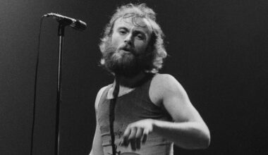 Phil Collins performing on stage with English progressive rock group Genesis, April 1976. (Photo by Michael Putland/Getty Images)