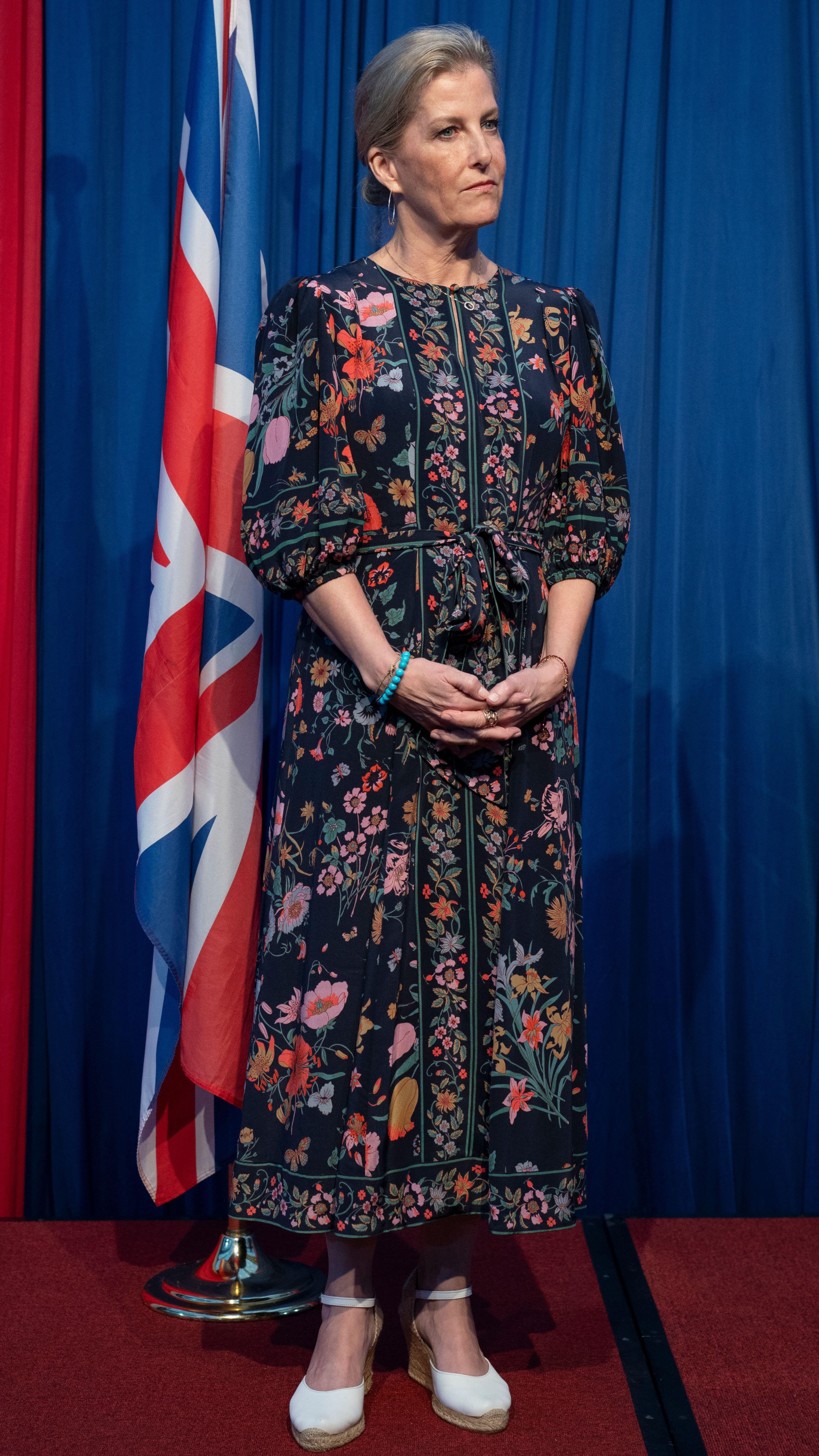 The Duchess of Edinburgh stands and listens during a Women In Leadership reception in Kenya