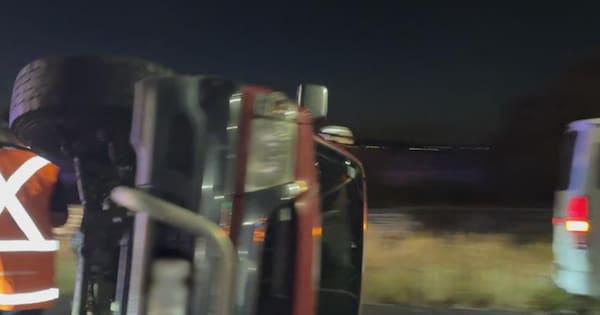 Commuter woes after car flipped onto its side on Auckland's SH1